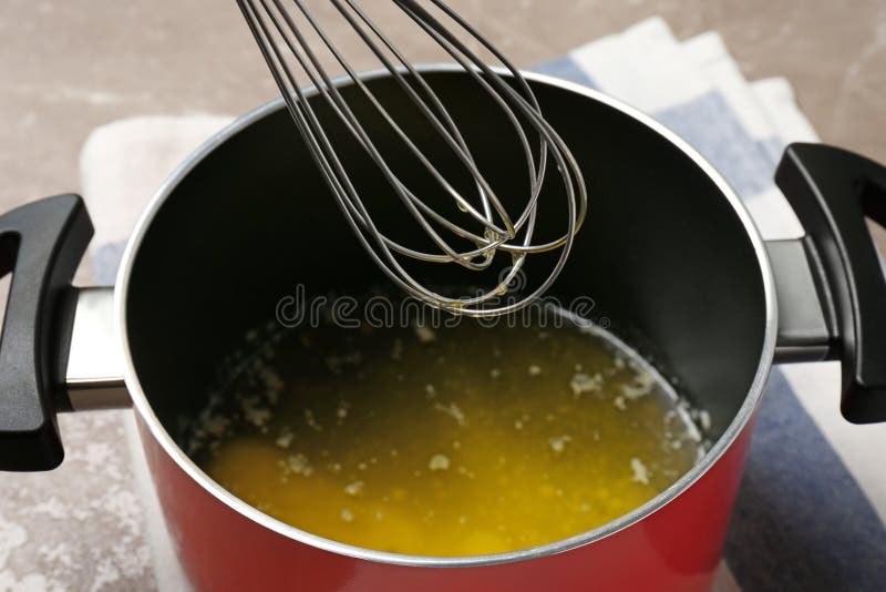 Pot with Melting Butter and Whisk on Table Stock Photo Image of