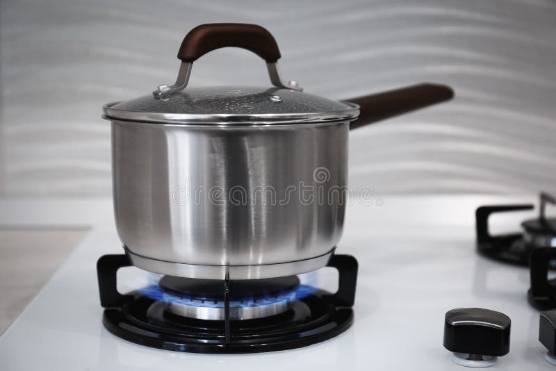 Pot on Modern Kitchen Stove with Burning Gas Stock Image Image of