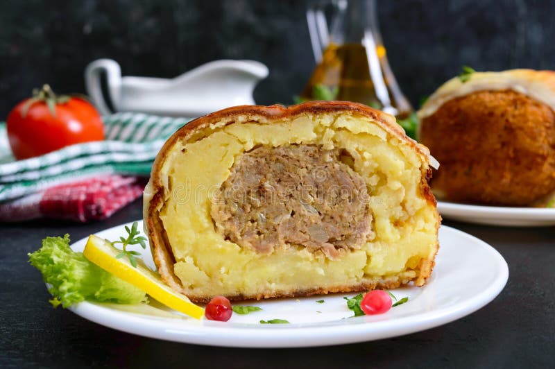 Potato Balls with Minced Meat in Deep Fat, Baked with Mozzarella. Stock