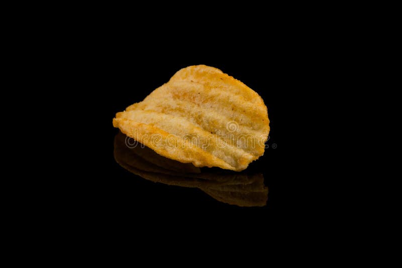 Potato Chip on Black Surface Stock Photo Image of fatty, isolated