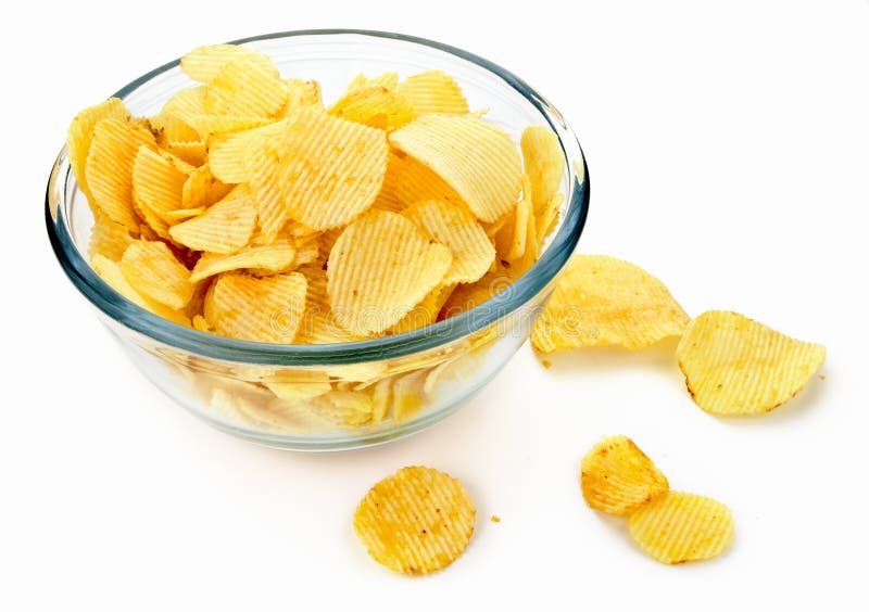 Potato chips in a glass bowl on white background. Crispy diet stock images, royalty-free photos and pictures