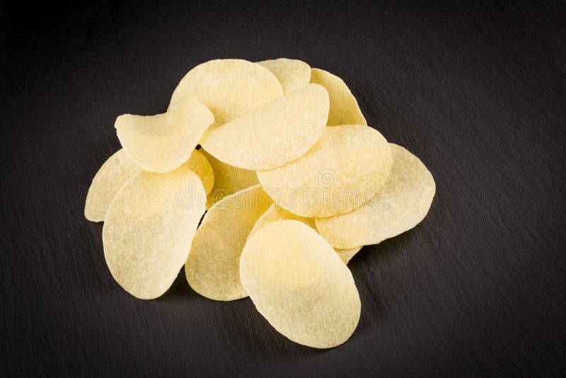 Potato Chips on a Black Background Stock Photo Image of closeup, meal
