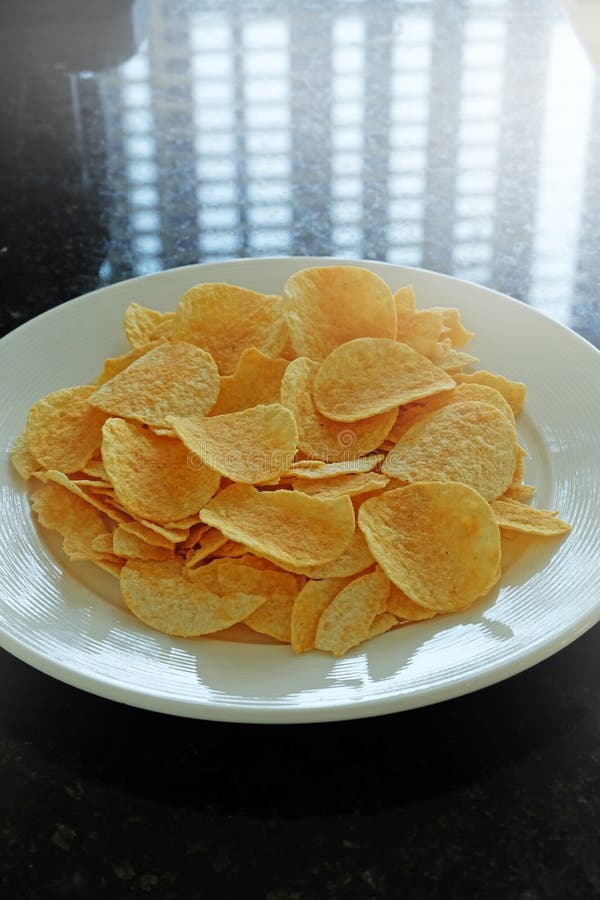 Potato chips in the dish stock photo. Image of crispy 45573892