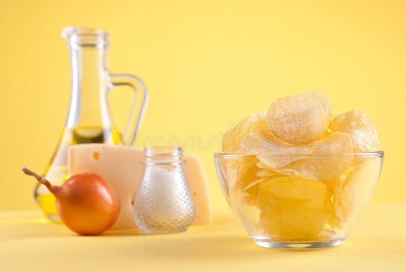 Potato Chips and Ingredients on an Isolated Background Stock Image