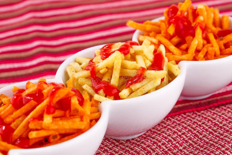Potato chips with ketchup stock image. Image of group 35002195
