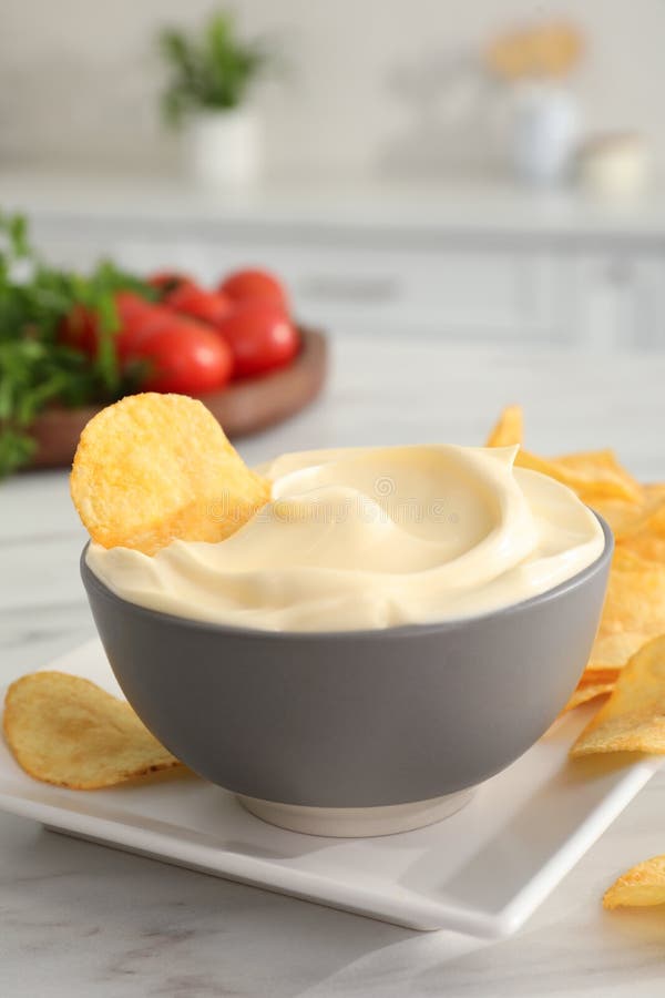 Potato Chips and Mayonnaise on White Marble Table, Space for Text Stock