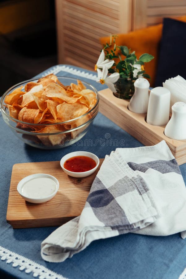 Potato Chips with Sauce on the Table. Homemade Sauces Stock Photo