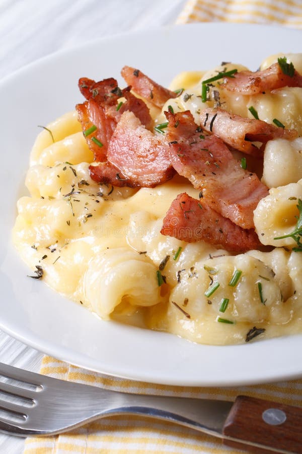Potato Gnocchi with Cheese Sauce and Bacon. Vertical Stock Image