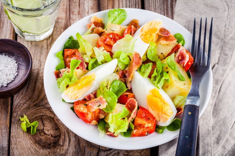 Potato Salad with Eggs, Lettuce, Tomatoes and Bacon Stock Photo - Image