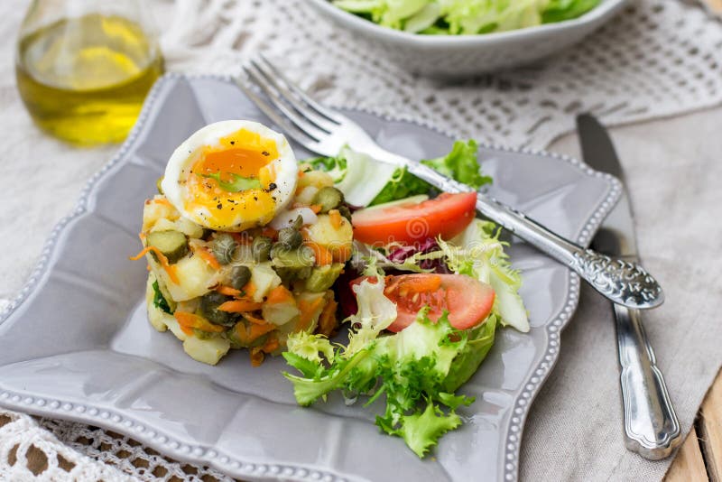 Potato Salad with Pickles, Carrots and Softboiled Egg Stock Image