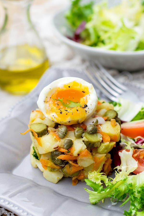 Potato Salad with Pickles, Carrots and Softboiled Egg Stock Photo