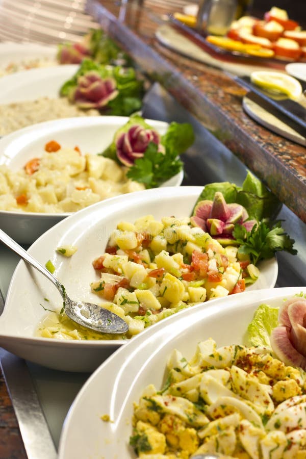 Potato salad in a white dish on open buffet royalty free stock image