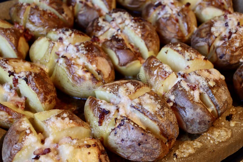 Potatoes baked with cheese stock image. Image of grated - 270537283