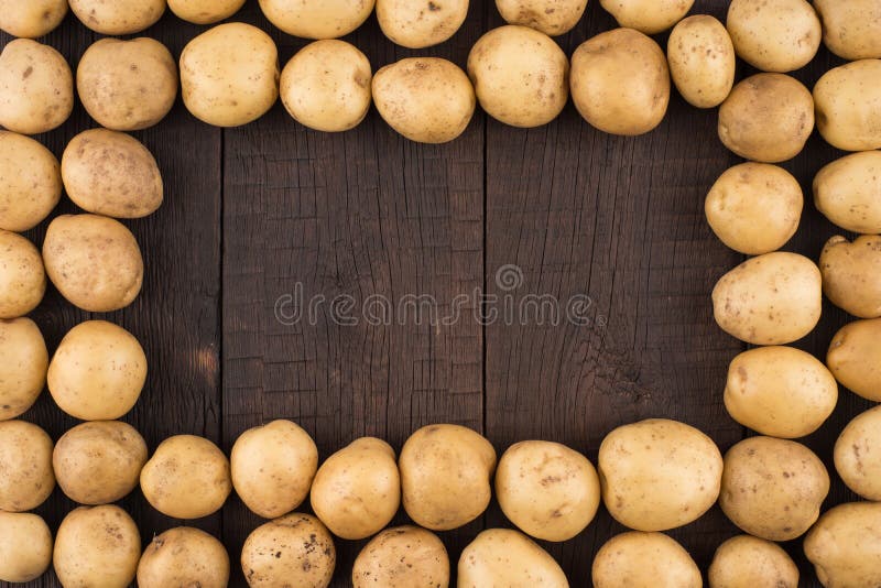 Potatoes on rustic wooden background. royalty free stock photo Potatoes on rustic wooden background. royalty free stock photo