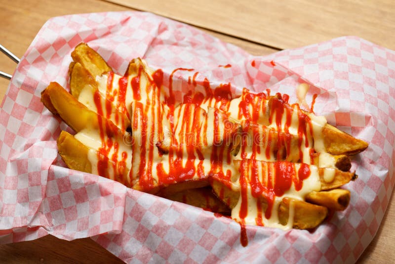 Potatoes with spicy sauce stock photo. Image of fast 150576754