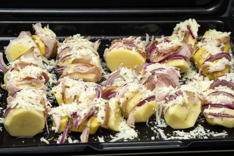Potatoes Stuffed with Onion, Pork Ham and White Cheese Stock Image