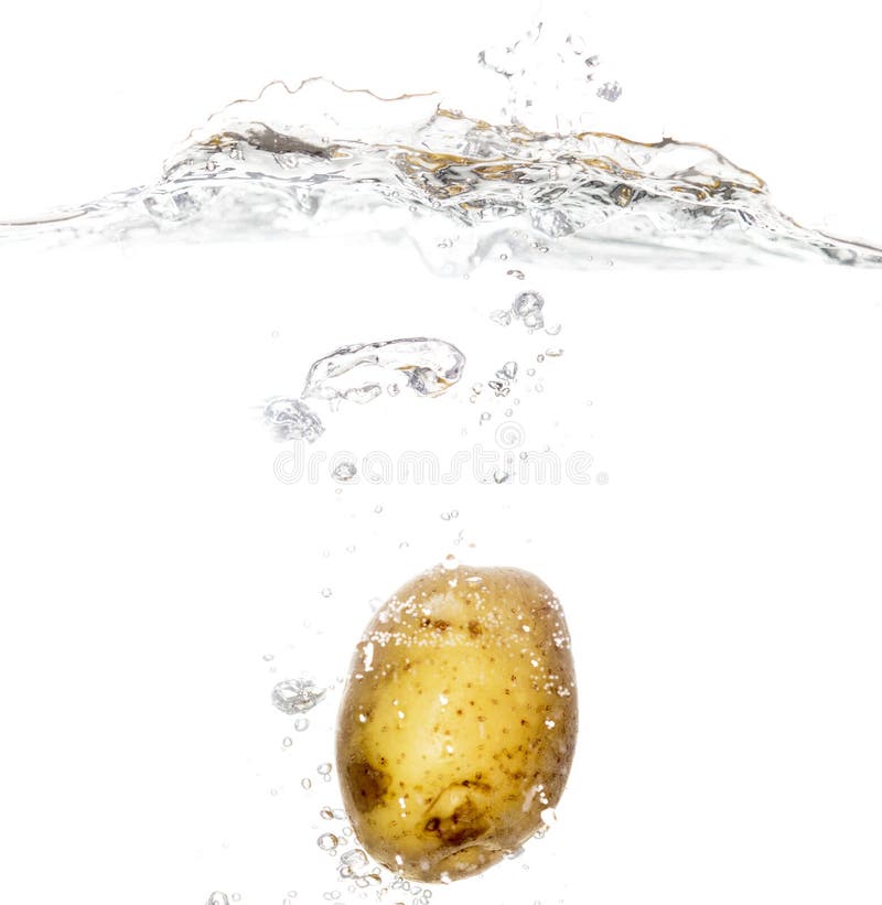 Potato In Water With Splashes On A Black Background Stock Image Image