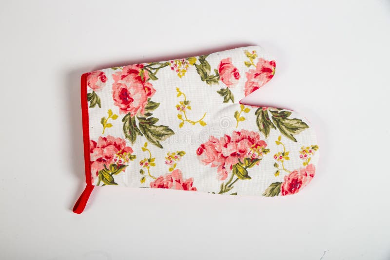 Potholder dla gorących naczyń z białymi kwiatami i czerwień graniczymy fotografia stock Potholder dla gorących naczyń z białymi kwiatami i czerwień graniczymy fotografia stock