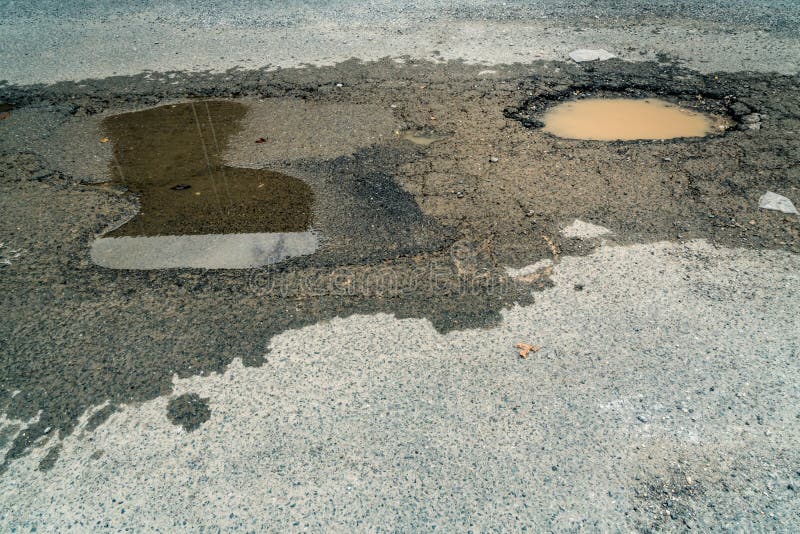 Pothole on the road stock photo. Image of transportation 100280768