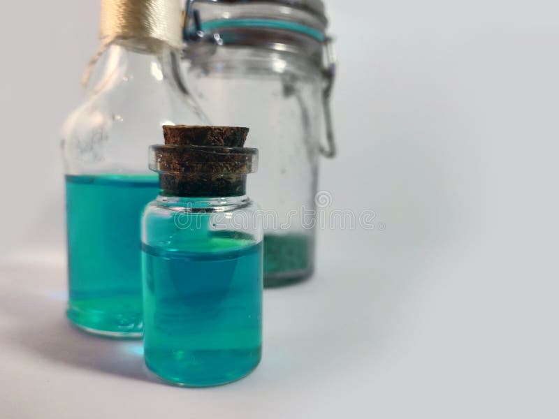 Potions with azure liquid. Alchemy set with flasks. small glass bottles with colored liquid for game role play. magic potions with royalty free stock images