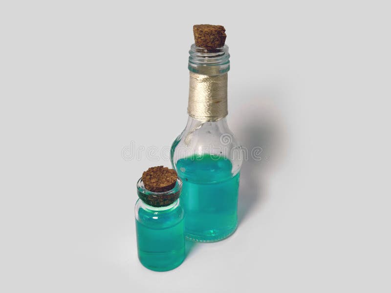 Potions with azure liquid. Alchemy set with flasks. small glass bottles with colored liquid for game role play. magic potions with stock photography