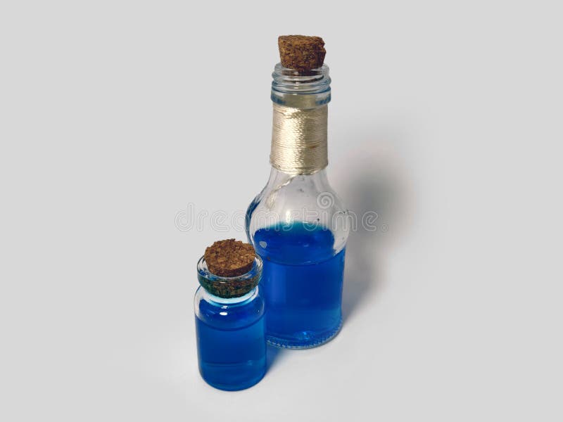 Potions with blue liquid mana. Alchemy set with flasks. small glass bottles with colored liquid for game role play. magic potions royalty free stock photo