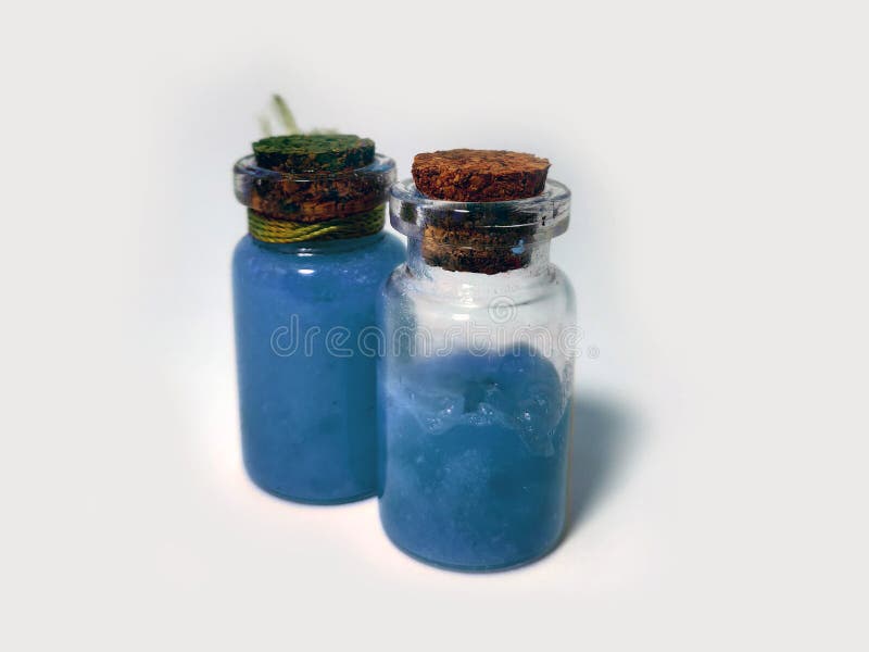 Potions with blue liquid mana. Alchemy set with flasks. small glass bottles with colored liquid for game role play. magic potions stock photos