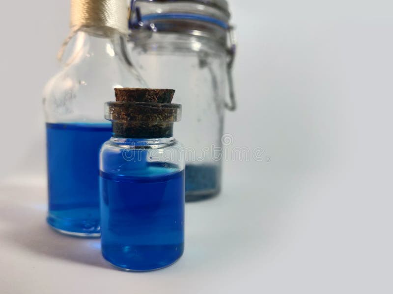 Potions with blue liquid mana. Alchemy set with flasks. small glass bottles with colored liquid for game role play. magic potions royalty free stock image