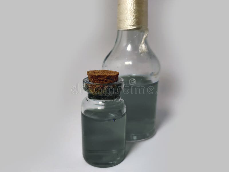 Potions with gray liquid. Alchemy set with flasks. small glass bottles with colored liquid for game role play. magic potions with stock photography