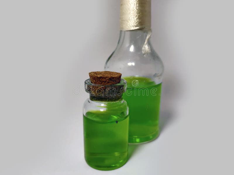 Potions with green liquid. Alchemy set with flasks. small glass bottles with colored liquid for game role play. magic potions with royalty free stock photos