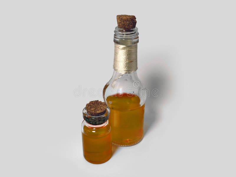 Potions with orange liquid. Alchemy set with flasks. small glass bottles with colored liquid for game role play. magic potions royalty free stock photos
