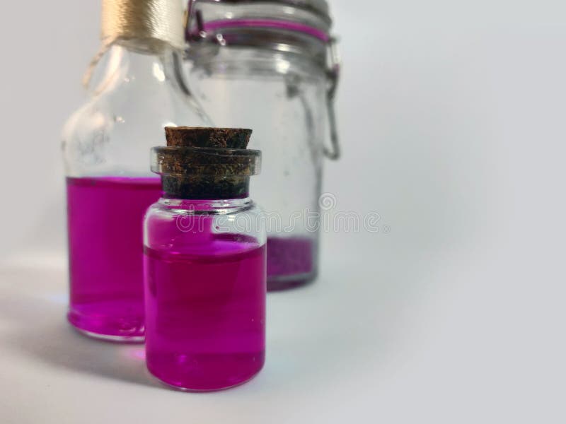 Potions with pink liquid. Alchemy set with flasks. small glass bottles with colored liquid for game role play. magic potions with royalty free stock image