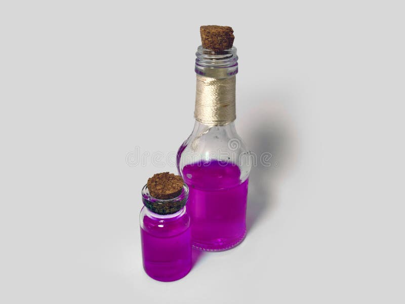 Potions with pink liquid. Alchemy set with flasks. small glass bottles with colored liquid for game role play. magic potions with royalty free stock photo