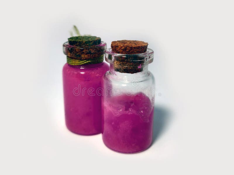 Potions with pink liquid. Alchemy set with flasks. small glass bottles with colored liquid for game role play. magic potions with stock image