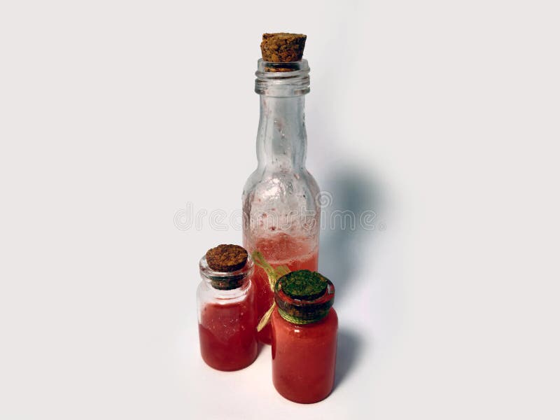 Potions with red liquid. Alchemy set with flasks. small glass bottles with colored liquid for game role play. magic potions with stock photography