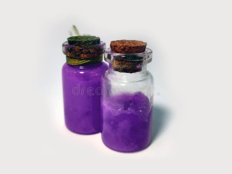 Potions with violet liquid. Alchemy set with flasks. small glass bottles with colored liquid for game role play. magic potions stock photo