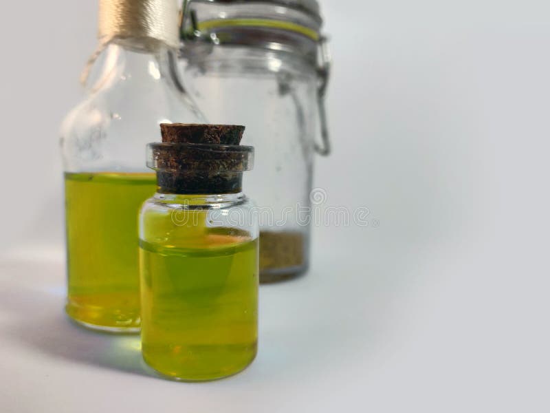 Potions with yellow liquid. Alchemy set with flasks. small glass bottles with colored liquid for game role play. magic potions stock photography