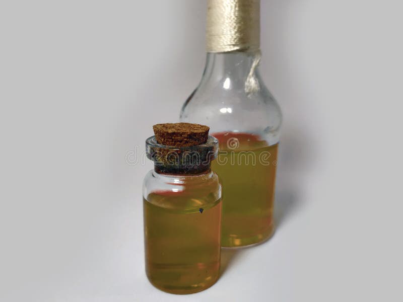 Potions with yellow liquid. Alchemy set with flasks. small glass bottles with colored liquid for game role play. magic potions royalty free stock photography