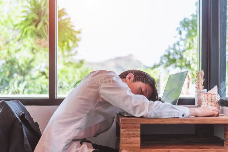 I need a vacation! Close up top view portrait of tired sick young. He is wearing the formal wear, resting at the workplace. I need a vacation! Close up top view portrait of tired sick young. He is wearing the formal wear, resting at the workplace.