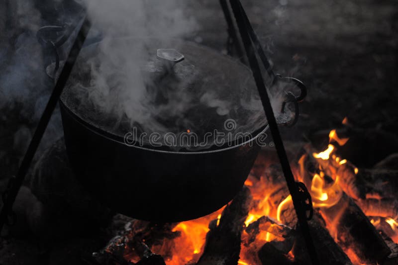 Pots over fire and steam coming from them, royalty free stock images Pots over fire and steam coming from them, royalty free stock images