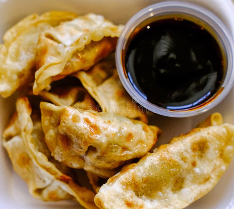Potstickers with Sauce stock image. Image of panfried 211787725