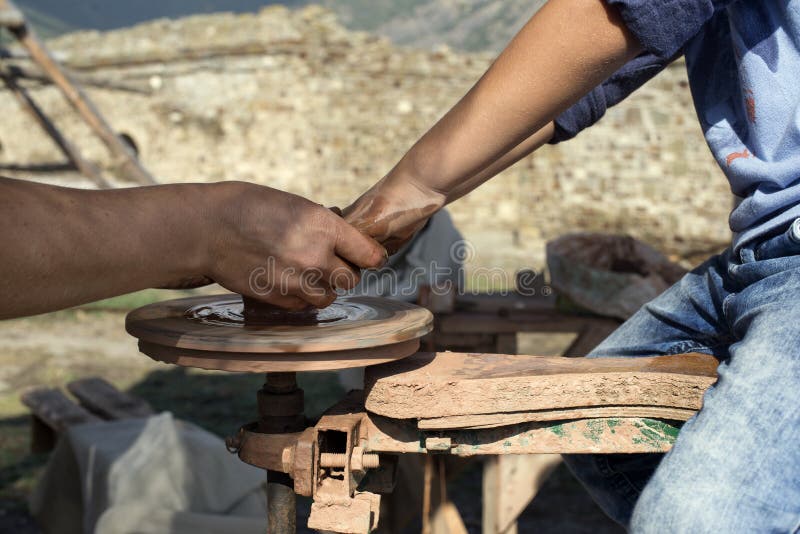 Potter Hands Guides the Child`s Hand Stock Image Image of craft