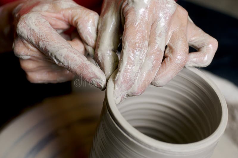 Potter working clay