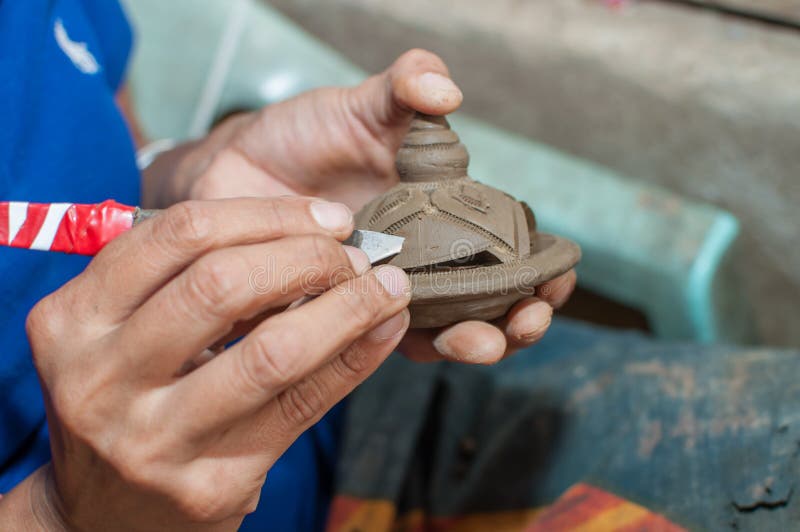 Pottery carving in hand stock photo. Image of religion 36114136