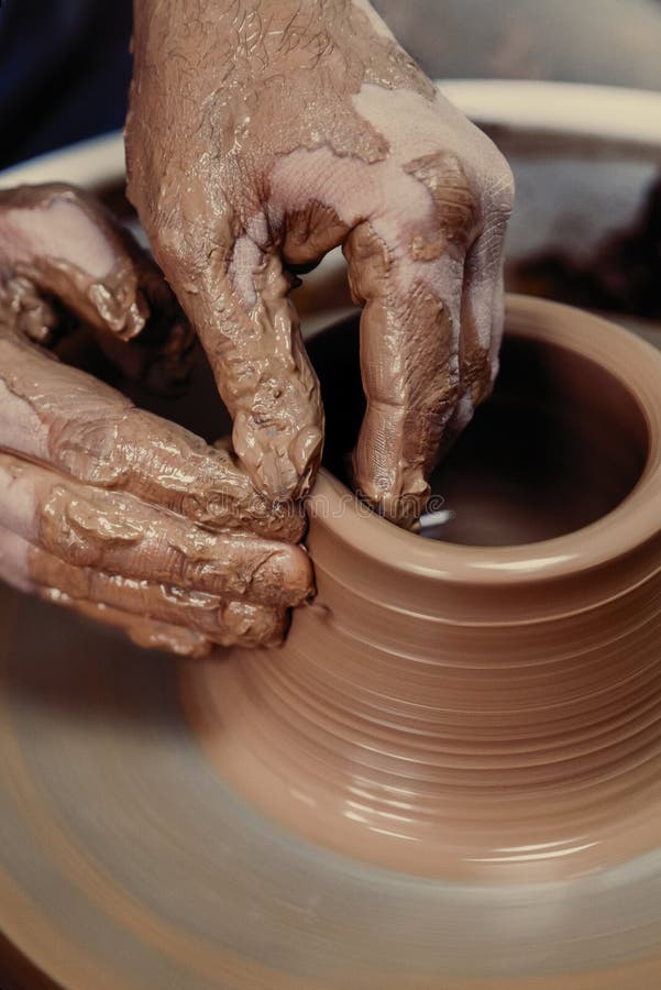 Pottery. the Master at the Potter`s Wheel, Produces a Vessel of Clay