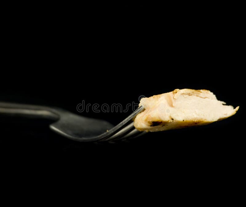 Poulet découpé en tranches sur la fourchette photos stock Poulet découpé en tranches sur la fourchette photos stock