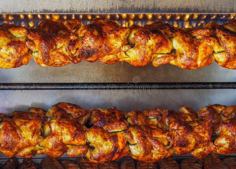 Chickens roasting on spit under gas flame in Mexico. Chickens roasting on spit under gas flame in Mexico