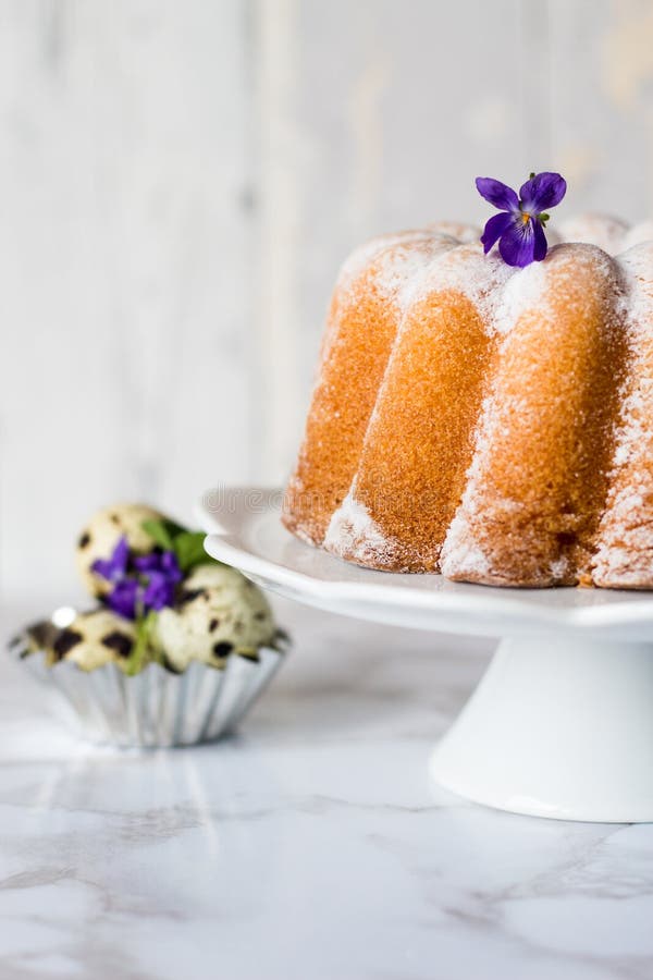 Easter Tasty Sour Cream Pound Cake and Pink Spring Flowers Stock Image