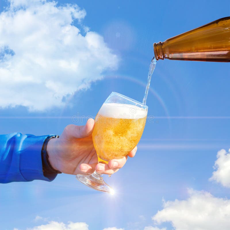 Pour Beer Into A Glass Against The Sky Stock Photo Image Of Full
