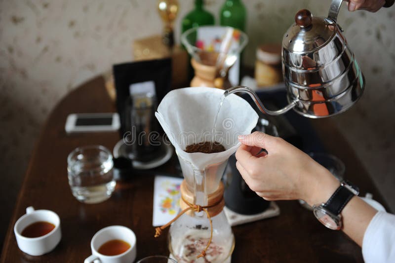 Pour Coffee from the Drip Kettle into the Paper Filter Stock Image